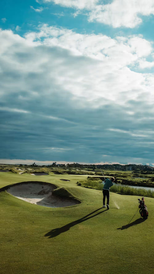 Man golfing on a scenic course