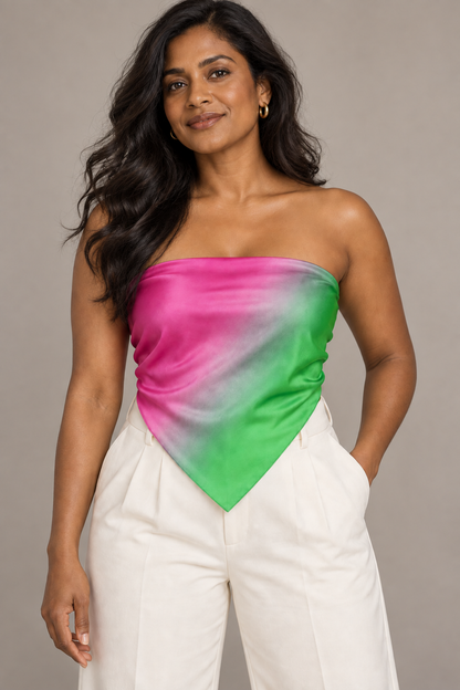 Radiant Oasis pink and green ombré silk scarf styled as a strapless blouse with ivory trousers.